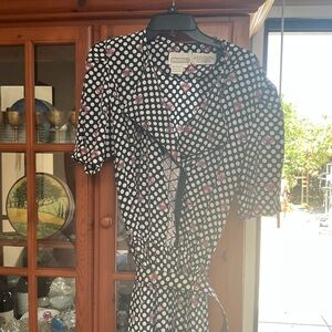 Stylish Black and White Polka Dot Dress with Pink Floral Design